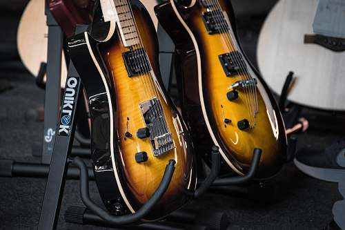 guitar two brown-and-black guitars leisure activities